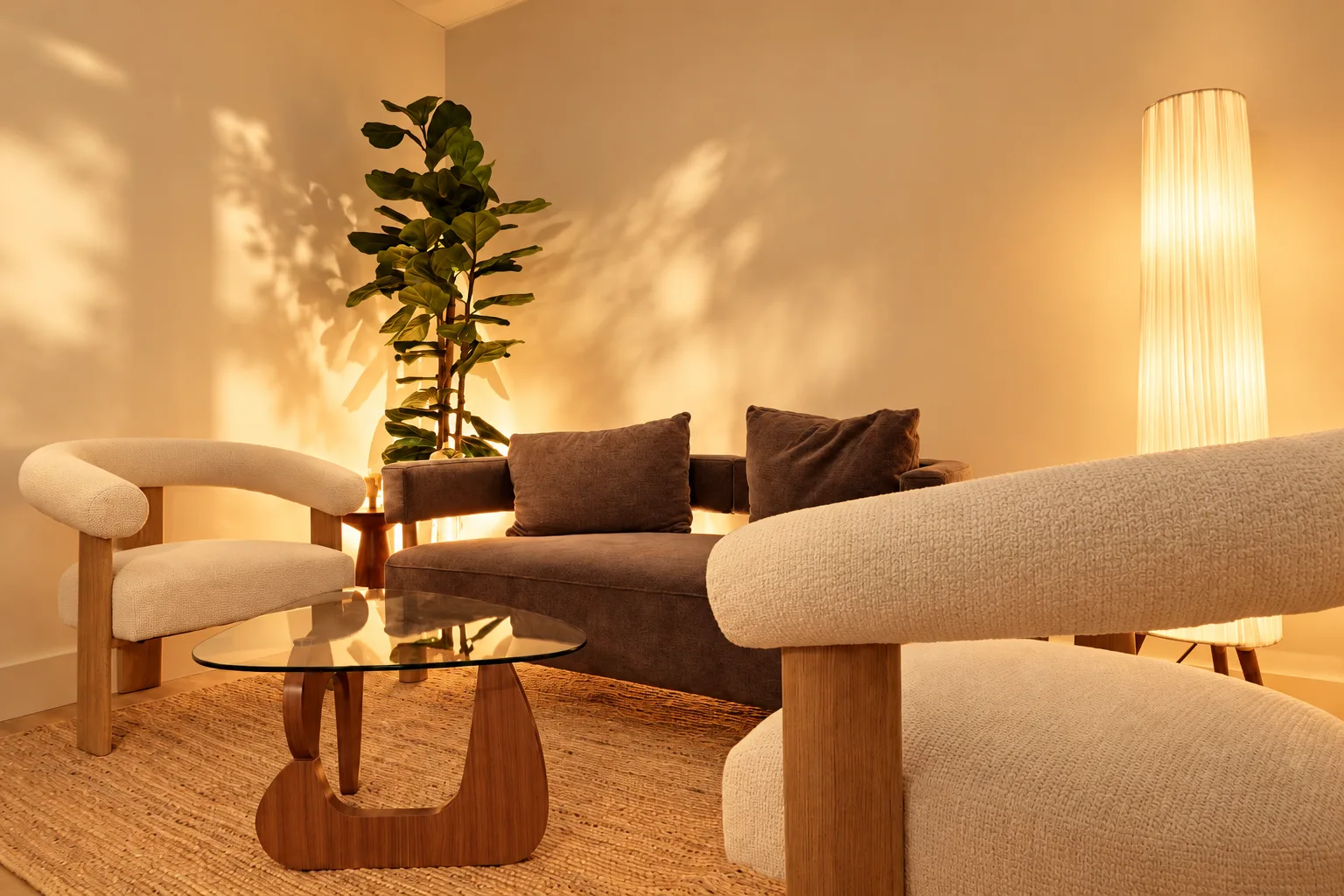 The Millán Spa lounge on Arthur Godfrey Road, Miami Beach: cream armchairs, a sofa and a paper floor lamp